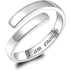 A silver-toned open band ring with the engraved words 'I am enough' on the inner band, shown on a clean white background.
